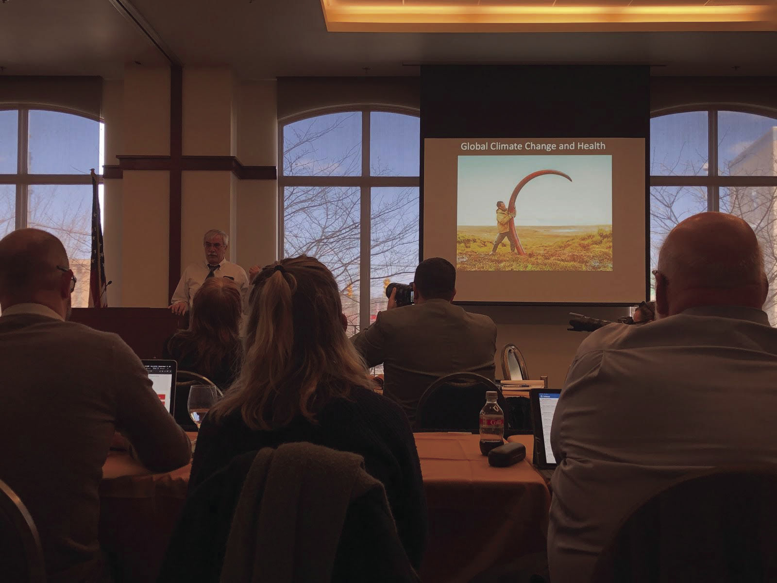 WVU’s Robert Duval presents a photo of a man finding the tusk of a woolly mammoth in the Siberian Tundra.